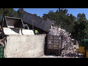 Roll Offs Dumping Recycle into a Tipper Trailer