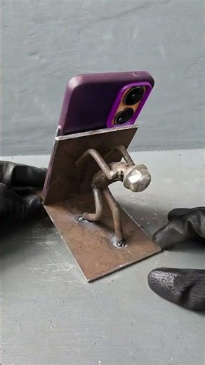 Industrial Metal Sculpture Phone Stand – Handcrafted Welder Art in Action