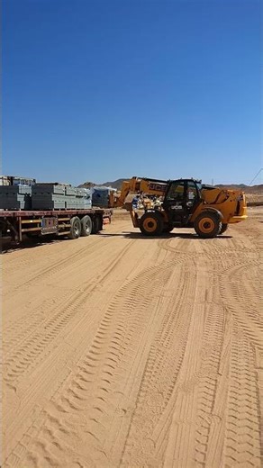 unloading works with telehandler forklift