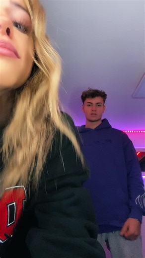 Dynamic Dance Moves Under Purple LED Lights