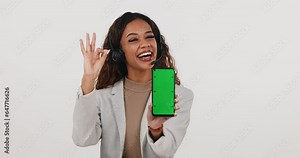 Call center, woman and green screen phone with ok sign for review on mockup white background. Portrait of customer service consultant with smartphone website, contact us and support tracking markers