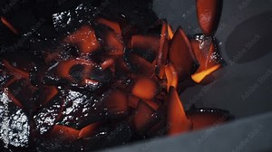 Metal scrap pile is collected in the steel container. Multiple pieces of scrap metal are dropping into the huge pile. Huge amounts of scrap metals are gathered in the pile. Metalworking facility.