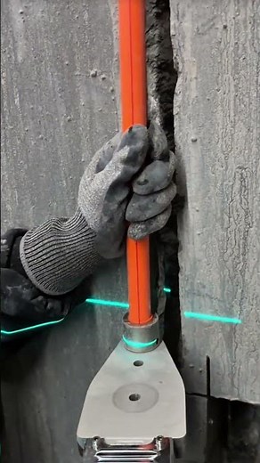 The process of installing a wall-mounted pipe using a holder and support bracket #construction