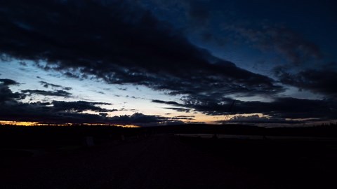 Rare noctilucent clouds paint beautiful dark landscape in Alaska