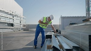Ill Middle Eastern man in hard hat holding chest having symptoms of heart attack stroke as Caucasian coworker running to colleague looking around searching help. Medicine and health care at warehouse