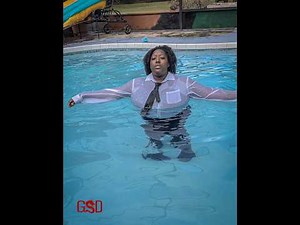 swimming in a shirt and tie