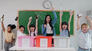 Teacher woman is teaching a class on selecting and separating waste for recycling, Student with recycle trash in classroom at elementary school