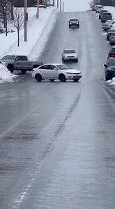 Cars Slide Out of Control on Icy Hillside Duluth, Minnesota — February 12, 2025 A sudden drop in temperature combined with light freezing rain turned a steep residential street into a treacherous ice rink this Wednesday. Commuters found themselves caught in a nightmare scenario as vehicles lost all traction on the slick pavement, sliding helplessly toward a growing pileup at the base of the hill. The footage captures several vehicles, including a dark blue SUV and a silver pickup truck, spinning
