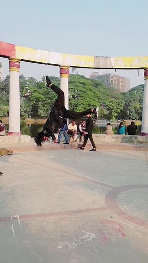 Young Man Performs Amazing Acrobatic Stunts in Park
