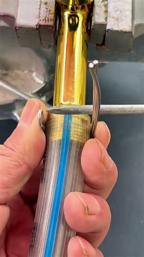 “Wire loop tightens grip—hidden assembly craft revealed in flawless cylindrical precision hold…”