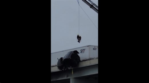 Viewer video shows the full rescue of the semi-truck driver from his cab dangling over an overpass on I-65. More: https://tinyurl.com/yf727rjz | WAVE