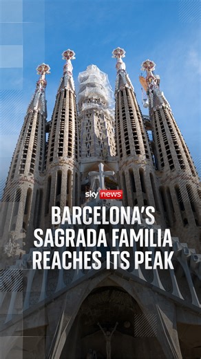 Barcelona's Sagrada Familia has reached its peak height of 172.5 metres, with the final piece of the cross placed on top the central tower. The unfinished monument is already the world's tallest church, though Catalan architect Antoni Gaudi's magnum opus remains years away from completion. | Sky News