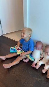 David sits next to the dolls sings, and plays the guitar. Funny Baby Video Reel! | David Family