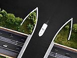 'Disappearing' aqueduct-like bridge carries boats across Dutch motorway