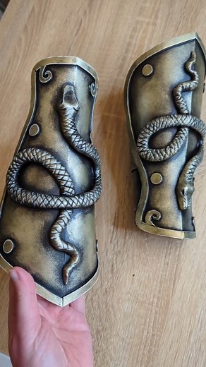 Athena's bracers 🐍 The base is made from 5mm thick EVA foam. I sculpted the snakes from foam clay and let them dry. Then I glued them on the bracers and primed everything. For painting I used my usual makeup sponge technique and used a fine brush to paint highlights with white acrylic. - - #cosplay #polyprops #diycrafts #diytutorial #crafting #tutorial | Lady Arthas Cosplay