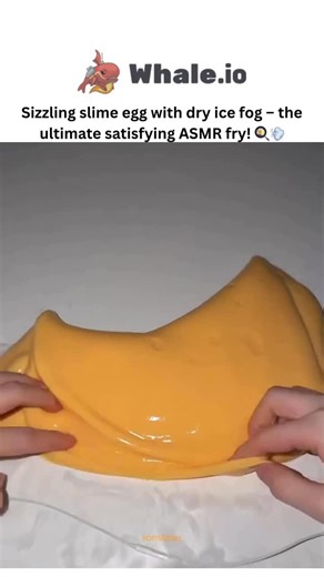 Sxrface ☠️ on Instagram: "- This post showcases a satisfying ASMR video of crafting a fried egg from yellow and white slime, where dry ice is embedded in the yolk for a foggy vapor effect, driving 3.8 million views and 11,800 likes within hours. - Posted by Indonesian creator @rejekianakbaik, a business-oriented content maker focused on tactile experiments, the video threads into follow-ups mimicking raw meat textures, tapping into the global slime ASMR trend for stress relief. - The fog arises