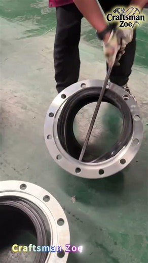 The worker used a pry bar to install the rubber flexible joint and flange together