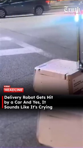 Truth Route News on Instagram: "This delivery robot was just doing its job, crossing at the crosswalk with its lights blinking like it’s supposed to. Then out of nowhere, a car plows straight into it. The robot flips over, collapses, and starts making distressed sounds that honestly feel way too close to crying. Whether it’s an alert system or programmed audio, the effect is brutal — it sounds hurt, confused, and abandoned. What makes it worse? The driver doesn’t stop. No pause. No check. Just d