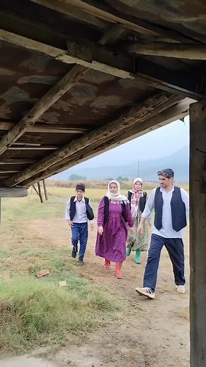 Enjoying bumpy rides and great conversations under the bridge! 🚶‍♂️🚶‍♀️🌉 #AdventureTime #FamilyMoments | Rural countryside