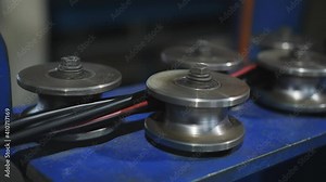 Wire drawing in the winding at the factory for the production of electric cable.