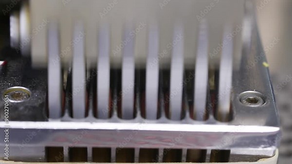 close up of capsule pill making machine. automatic semi machine filling capsule shells. pill making process in a pharma factory. bulk capsule medicine making machine. automatic machine filling capsule