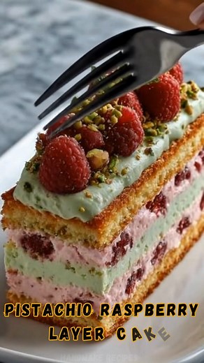💚 Pistachio Raspberry Layer Cake | Protein 12g Elegant layers of pistachio cream and raspberry mousse nestled between soft sponge cake — this stunning dessert is light, nutty, fruity, and perfect for any celebration. 🎂✨ 📝 Ingredients: **For the Sponge Cake:** ✦ 1 ½ cups all-purpose flour ✦ 1 ½ tsp baking powder ✦ 4 eggs ✦ ¾ cup sugar ✦ ½ cup butter, melted ✦ 1 tsp vanilla extract **For the Pistachio Cream Layer:** ✦ ½ cup pistachio paste or finely ground pistachios ✦ 1 cup heavy cream ✦ 2 tbs