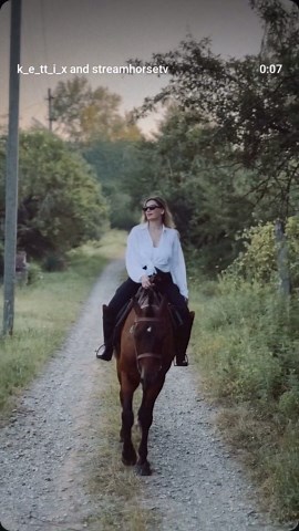 streamhorse: woman riding a horse on country road