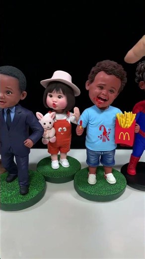 Lively Handmade Clay Bobbleheads Swinging with Glee