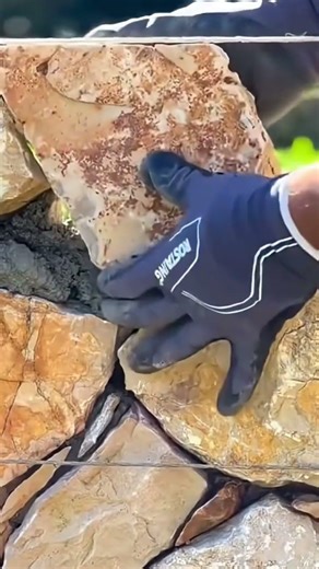 Making a fence from stacked stones step by step