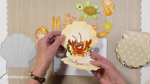 Happy Technique Friday, crafters! Els is taking us under the sea this week, showing us how to create this Oyster Shell Card with a Pop Up! 🌊🐚 Watch the full tutorial here: https://youtu.be/tfYotoshXfg | Elizabeth Craft Designs
