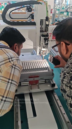Indian customer learning the operation of screw locking machine