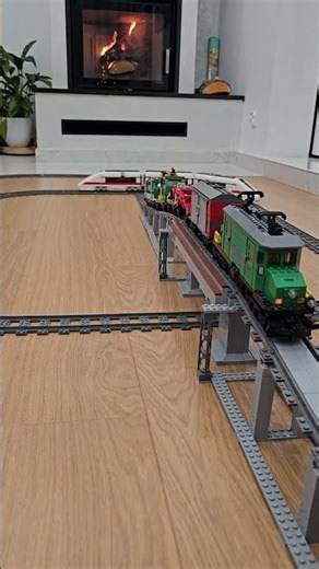Classic LEGO trains on bridge and crossing with fireplace in the background 🔥