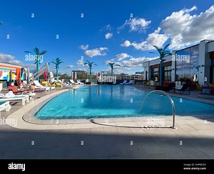Orlando, FL USA -  December 23 2021: The outdoor amenities with a swimming pool, cabanas and lounge chairs at the Wave Hotel at Lake Nona in Orlando Stock Photo - Alamy
