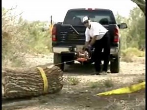 Lewis Winch skids log around a corner using a Lewis Winch snatch block