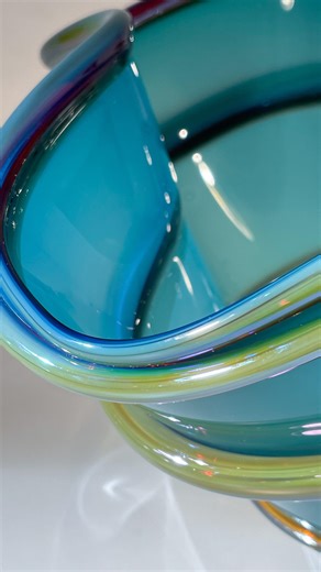 This is the Bugaboo Bowl that we made during our Solstice celebration. The colours turned out spectacularly when they cooled, and the thick glass accent that wraps around the bowl has a lovely iridescent sheen. #bavinstudios #invermerepanorama #livecolumbiavalley #blownglass #madeincanada | Bavin Glassworks