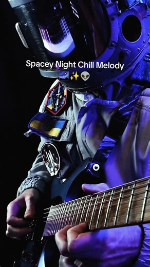 Spaceman playing chill melody on the guitar