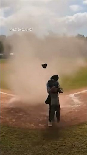 Dust devil engulfs little leaguer