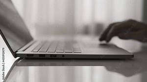 Close-up of man hands typing on laptop keyboard. Businessman writing business letter. Man closing laptop with one hand. 4K, UHD