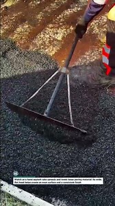 Manual Asphalt Rake Levels Fresh Blacktop for a Smooth Surface Fast #Asphalt #Paving #Construction