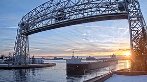 8.4K views · 676 reactions | The American Mariner sailed under the Duluth Aerial Lift Bridge this afternoon with a beautiful November Sunset as a backdrop. | Destination Duluth | Facebook