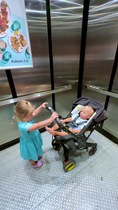 Cute kids are having fun in the elevator | Naomi Day