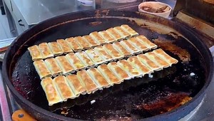 1.1M views · 6.9K reactions | How FLAT fried dumplings (pot stickers) and sweet steamed rice cakes are made :-) | Strictly Dumpling | Facebook