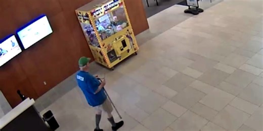 Kid rescued after climbing into claw machine, getting stuck