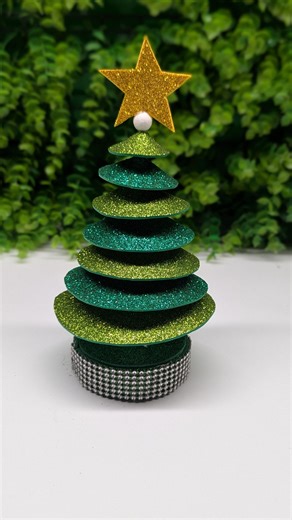 How to Make a Mini Glitter Christmas Tree | DIY Christmas Decor Bring sparkle to your holiday décor with this easy DIY glitter Christmas tree! 🌟 In this tutorial, I’ll show you step by step how to make a beautiful mini Christmas tree using glitter foam sheets, a star topper, and simple craft supplies. Perfect for table décor, gifts, or festive home decorations. Materials Used: Glitter foam sheets (green & gold) Star topper Small base with ribbon Hot glue gun Create your own festive decorations 