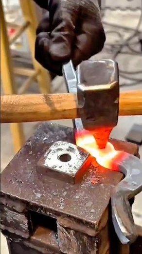 The Traditional Blacksmith Forging Process of Shaping Hot Metal Using Hammer and Anvil