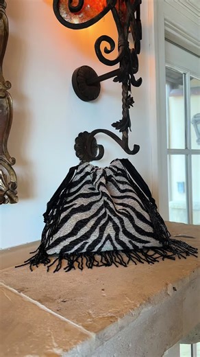 Explore the Le Pouch Small Handbag with Beaded Fringe