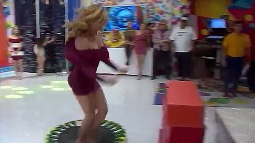 Spanish TV presenter flashes her bum after leaping onto mattress