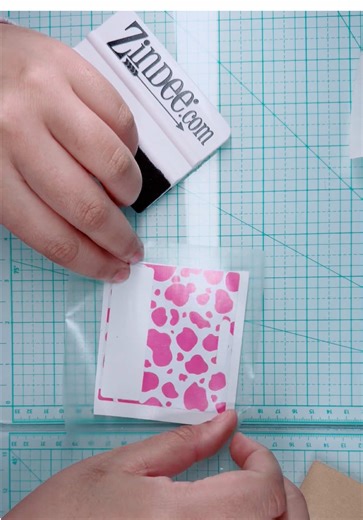 A little behind the scenes of this adorable badge buddy coming together 💕✨ This one started with the cutest pink and white cow print vinyl and honestly I’m obsessed with how it turned out. First step was adding the baby pink glitter layer to give it that extra sparkle ✨ Then I sealed the glitter so everything stays smooth, durable, and ready for everyday wear. After that, it was time to add the details! I carefully placed the white “Radiology” vinyl on top so it pops perfectly against the glitt