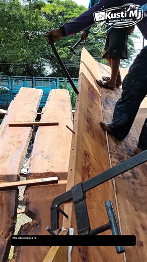 Manual Timber Alignment and Joining Process in Outdoor Wood Construction.