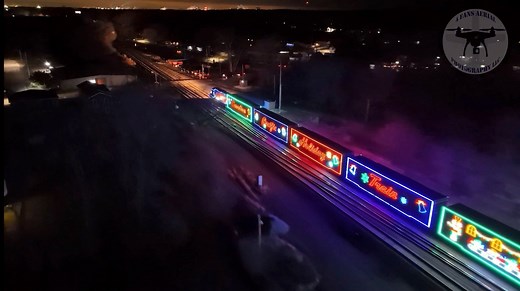 This aerial video courtesy of “4 Fans Aerial Photography” shows the CPKC Holiday Train rolling through Chesterton, IN around 4:20 AM, Saturday. The tracks along the entire route were filled with people trying to capture a glimpse of this rare train as it works its way to Bensenville, IL from Canada for the next performance. | Region News Source